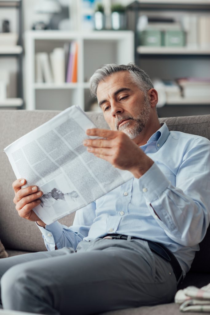 businessman reading a newspaper 2023 11 27 04 50 15 utc scaled